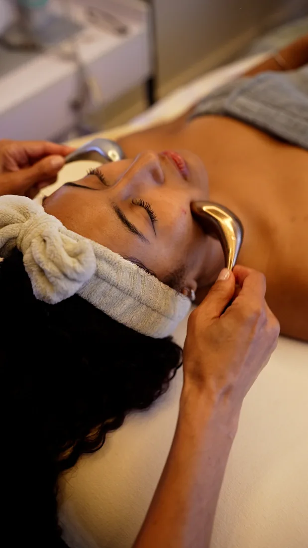 A patient receiving facial care at VIKARA