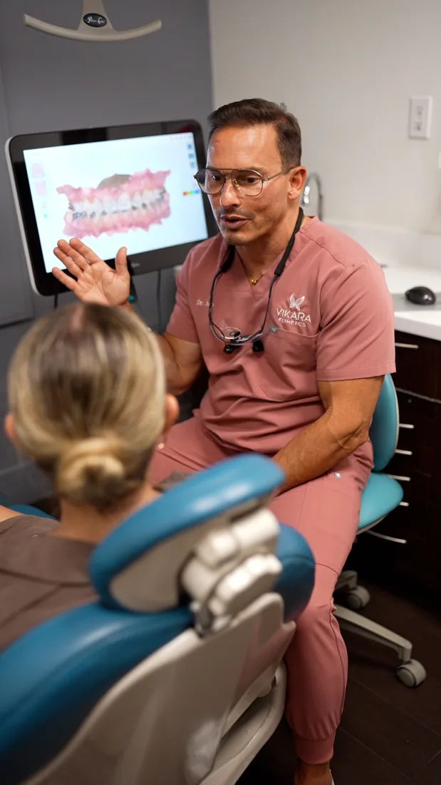 Dr. Julio discussing a dental scan with a patient