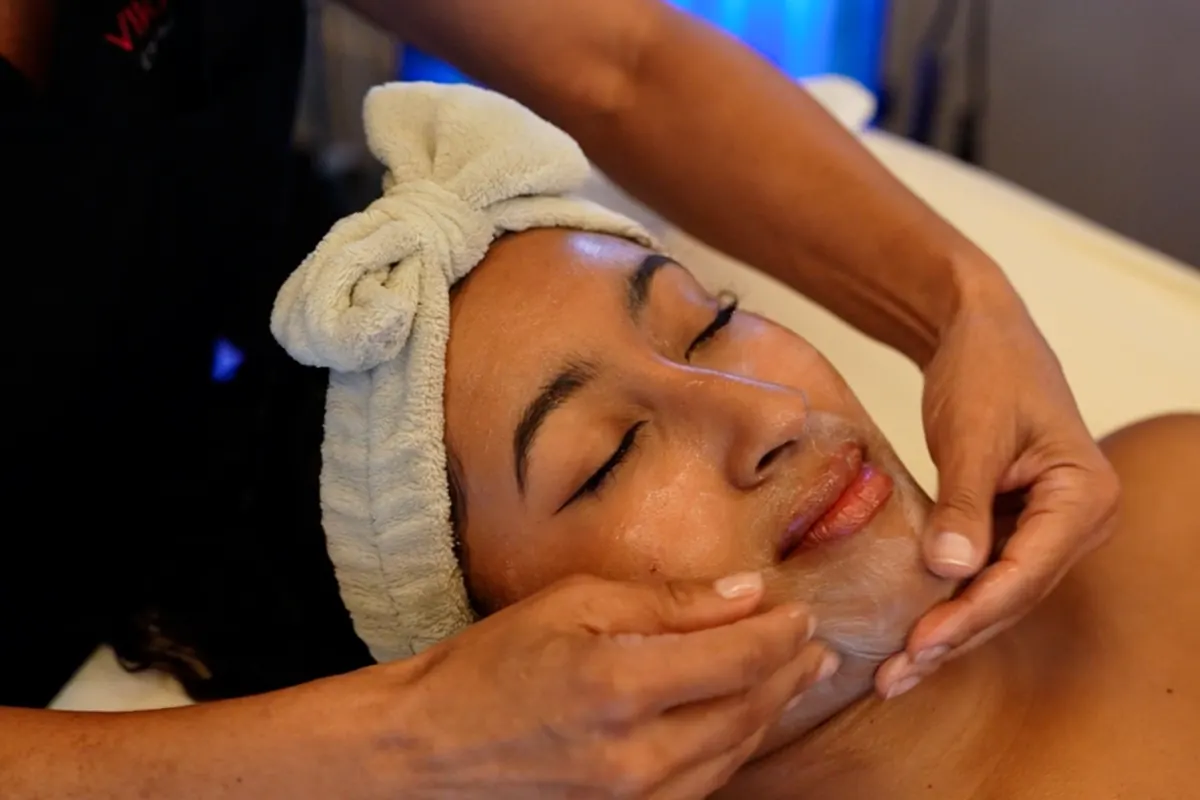 A VIKARA esthetician resurfacing along the cheek