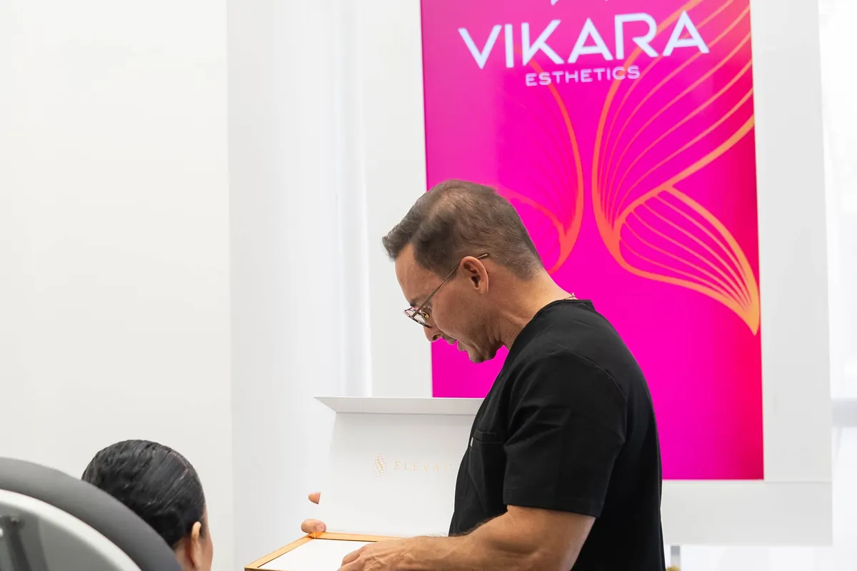 A VIKARA clinician preparing notes at the counter