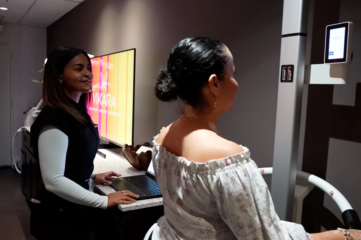 A patient reviewing her programme with a VIKARA team member