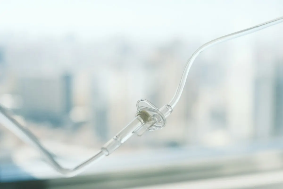 An infusion line running to a seated patient