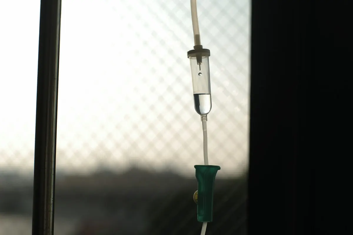 An infusion line backlit by window light