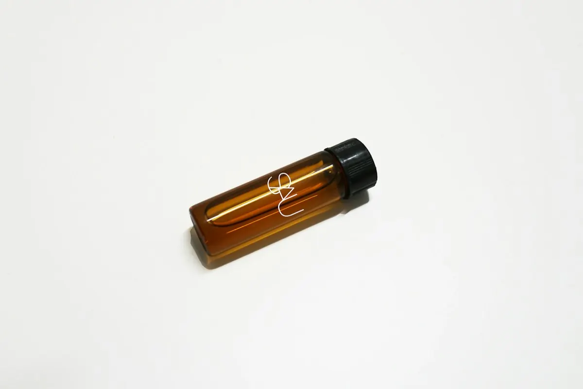 A small amber treatment vial on a clean surface